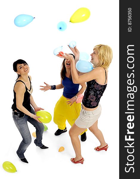 Full body view of three lovely women playing together at party with lots of colorful balloons floating all around. Isolated on white background. Full body view of three lovely women playing together at party with lots of colorful balloons floating all around. Isolated on white background.