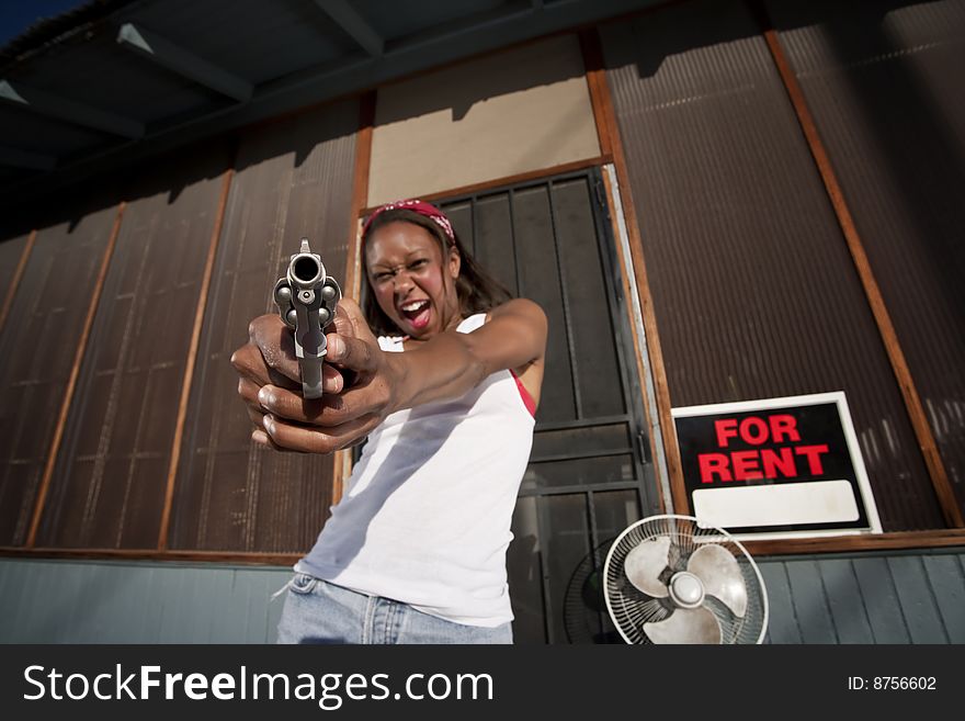 African American woman with a gun on her front porch. African American woman with a gun on her front porch