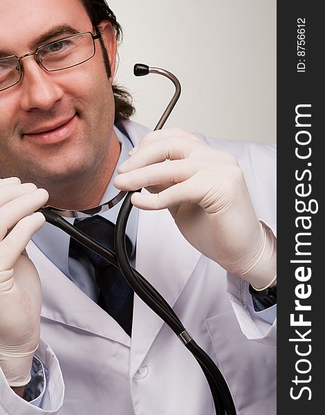 Smiling doctor with stethoscope over white. Smiling doctor with stethoscope over white