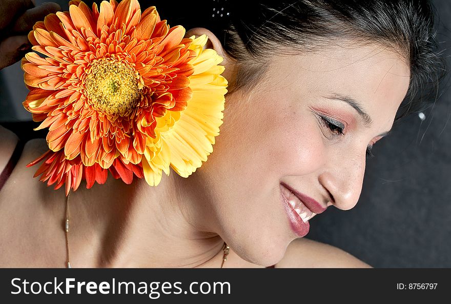 Girl with flower in studio.