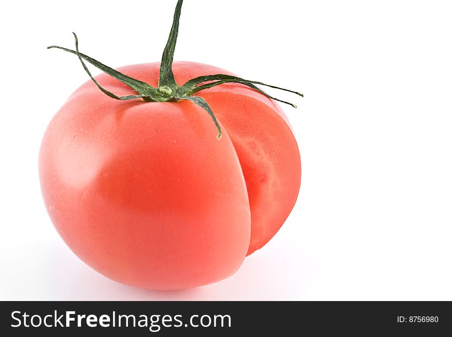 Cut tomato on white background. Cut tomato on white background