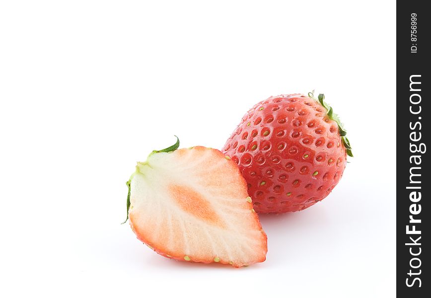 Cut strawberries on white background