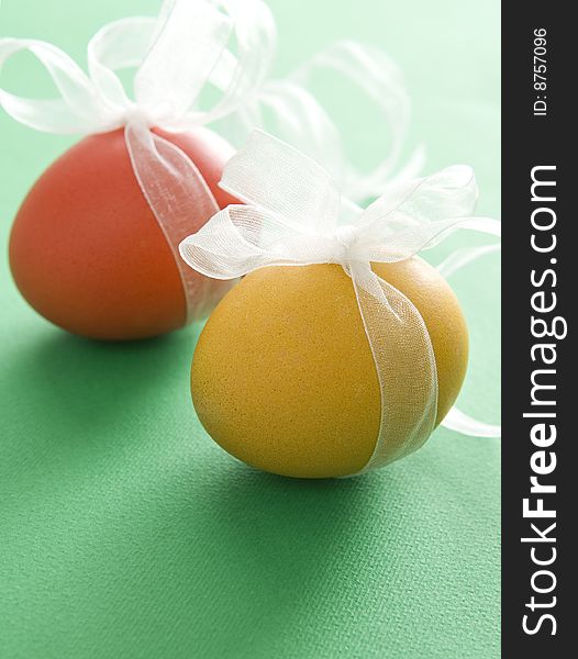 Colorful easter eggs with transparent white ribbon. Colorful easter eggs with transparent white ribbon