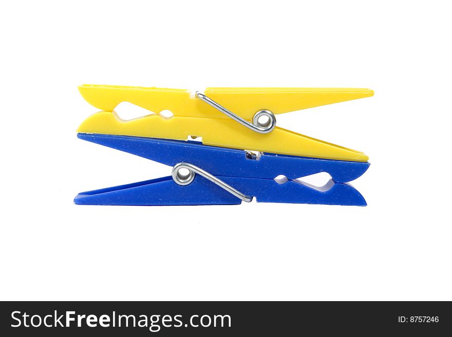 Coloured clothespins on a white background