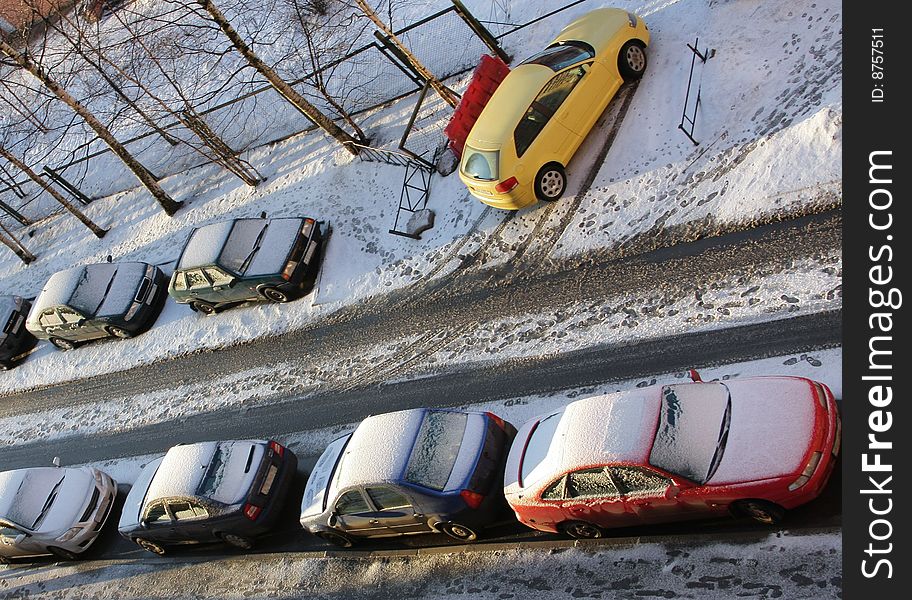 Cars in a court yard. The top view