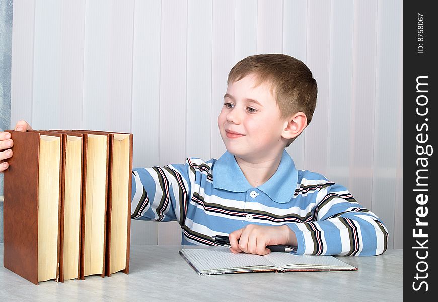 The child with books on the table