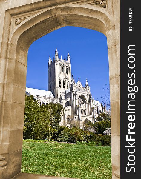National cathedral in Washington DC through an arch on a stone wall. National cathedral in Washington DC through an arch on a stone wall.