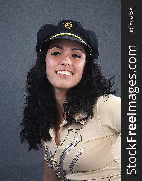 Lovely girl smiling with dark blue nautical cap. Lovely girl smiling with dark blue nautical cap