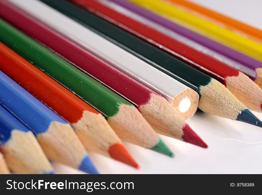 Closeup of colored pencils on white background