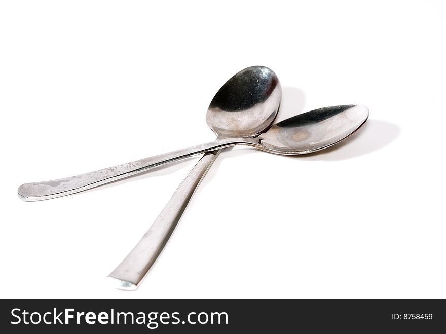 Close up metal spoon on white background. Close up metal spoon on white background