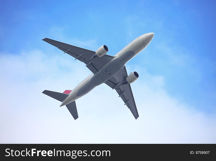 The airplane on  the blue sky background. The airplane on  the blue sky background.