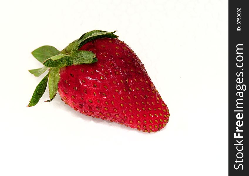 Strawberries with sheet green on white background