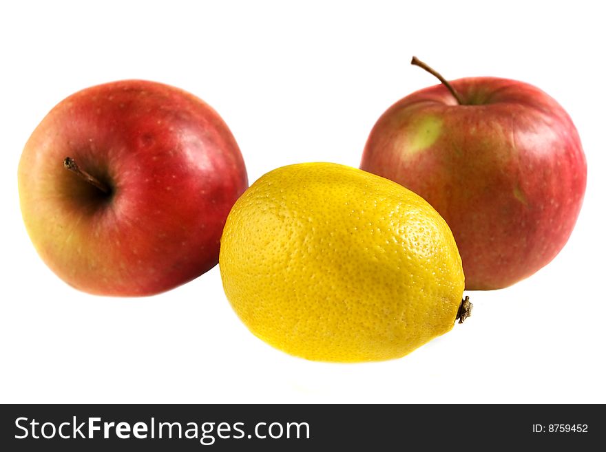 Lemon and apples isolated on white background