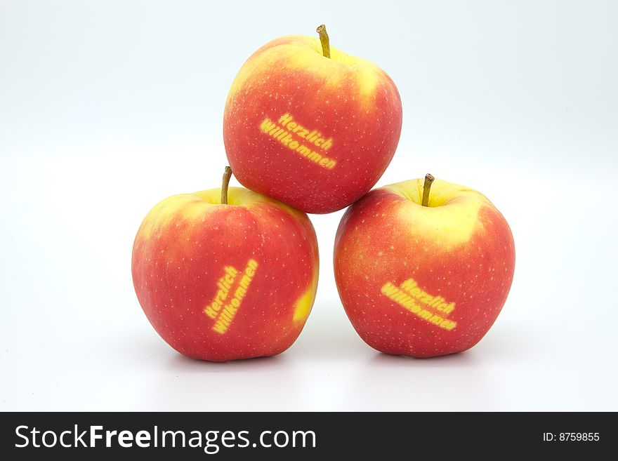 Three Welcome-Apples are showing a nice and friendly welcome!. Three Welcome-Apples are showing a nice and friendly welcome!