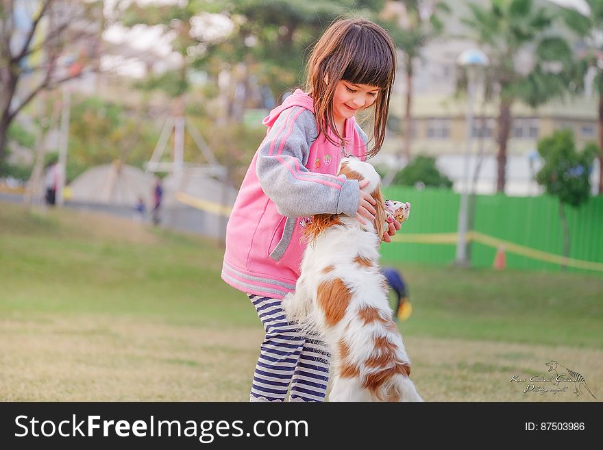 Portrait of a Smiling Young Woman With Dog