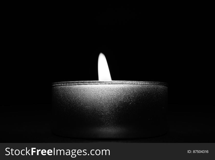 Close-up of Candle over Black Background