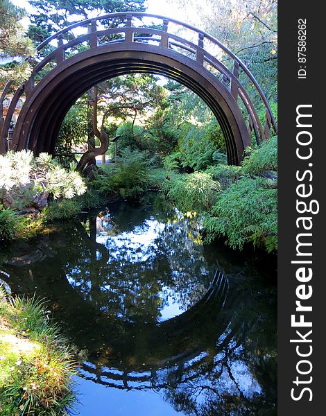 Japanese arched bridge with reflection