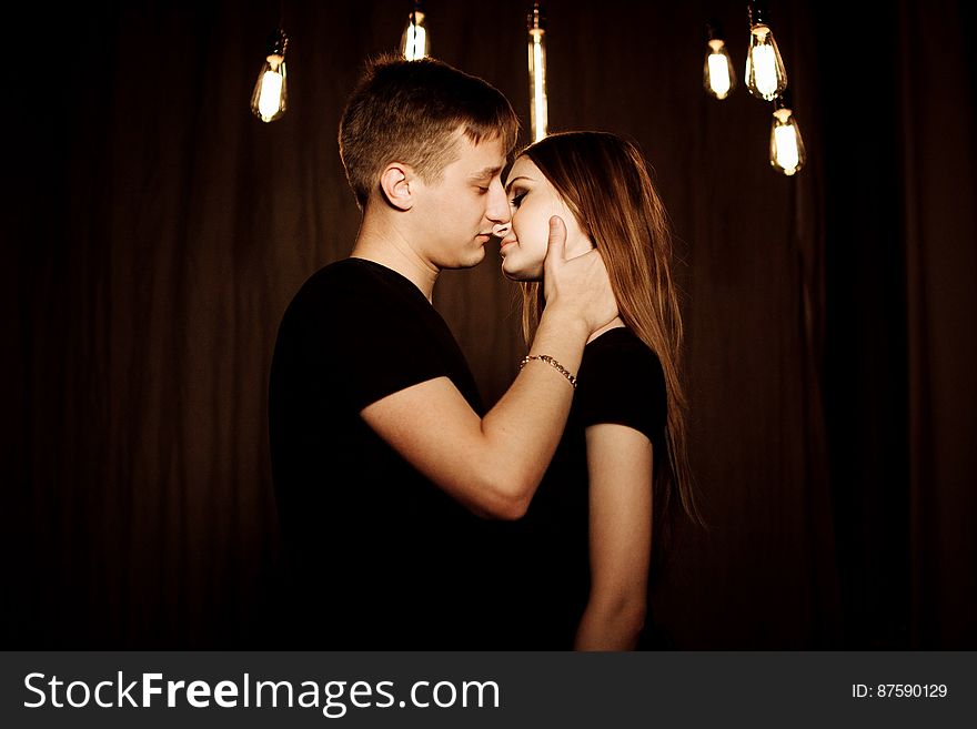 Young Couple Kissing at Night