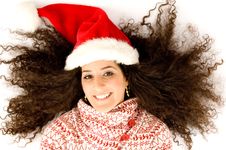 Female With Christmas Hat And Lying Royalty Free Stock Photography