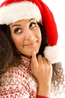 Woman Wearing Christmas Hat And Thinking Something Stock Photo