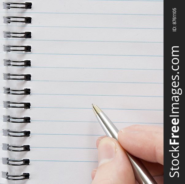 Close-up of male hand with pen ready for writing. Close-up of male hand with pen ready for writing