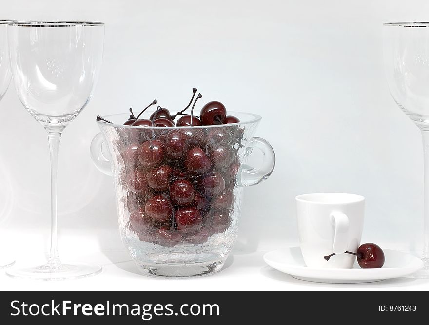 Icebucket with plastic cherry on the table