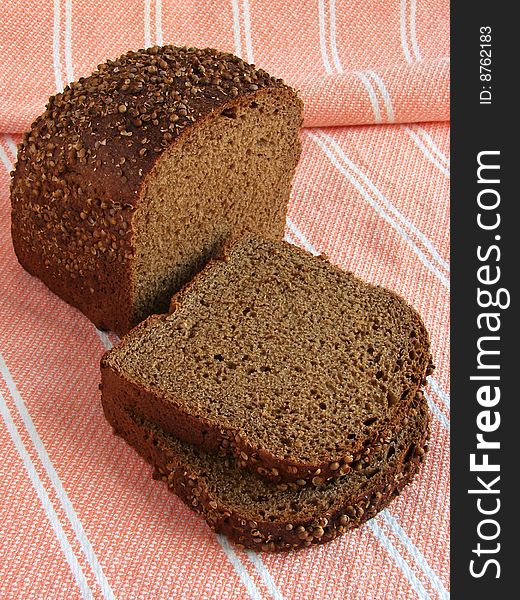 Spicy black bread slices with coriander seeds