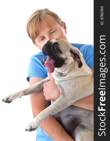 Mature Lady Cuddling a Female Pug Dog with Tongue Stuck WAY Out, Isolated on a White Background. Mature Lady Cuddling a Female Pug Dog with Tongue Stuck WAY Out, Isolated on a White Background