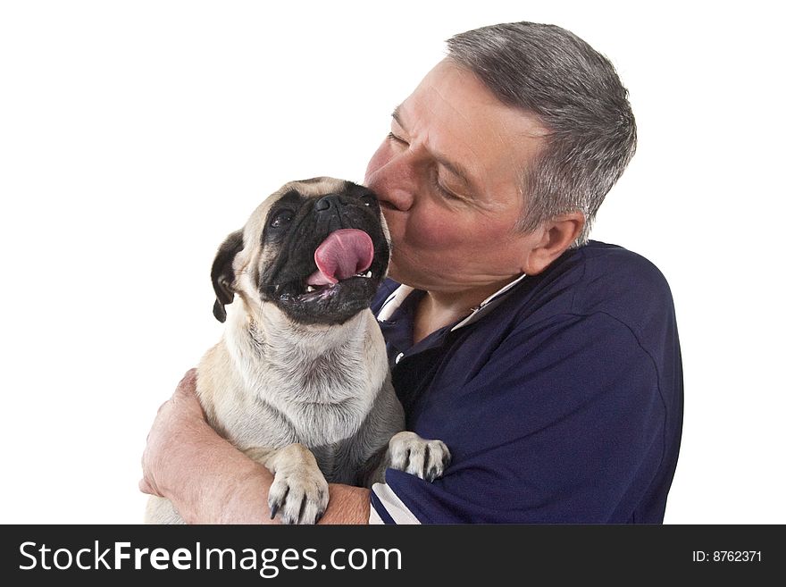 Mature man holding a Pug dogs with it's tongue stuck out, isolated on a white background. Mature man holding a Pug dogs with it's tongue stuck out, isolated on a white background