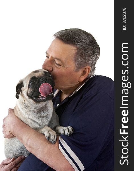 Mature man holding a Pug dogs with it's tongue stuck out, isolated on a white background. Mature man holding a Pug dogs with it's tongue stuck out, isolated on a white background