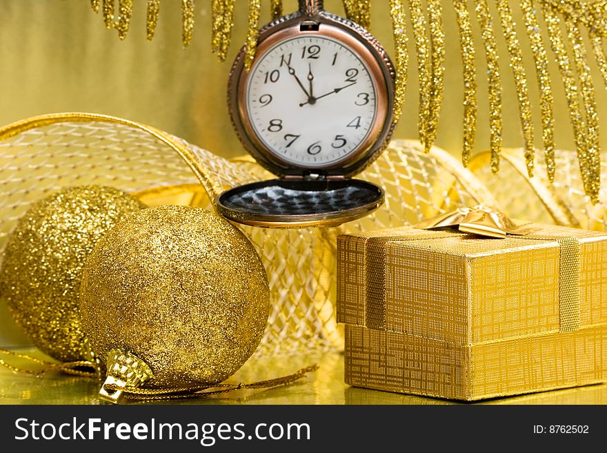 Christmas balls and gift box with clock