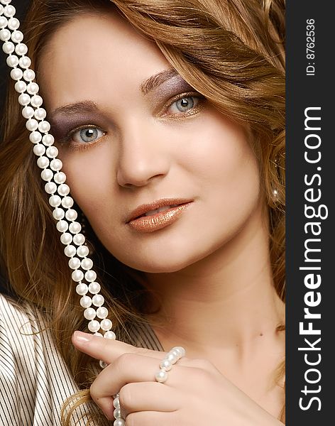 Fashion girl portrait with pearls