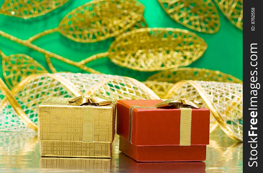 Golden and red gift boxes with leaves