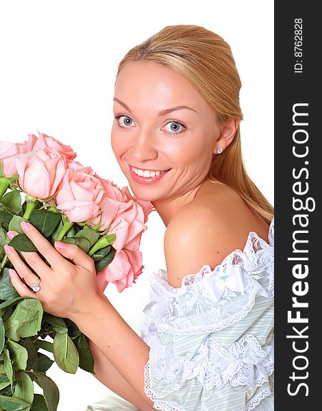 Portrait of the beautiful woman with a bouquet of roses of gently pink color. Portrait of the beautiful woman with a bouquet of roses of gently pink color