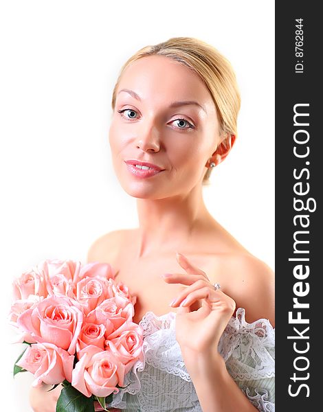 Portrait of the beautiful woman with a bouquet of roses of gently pink color, isolated on a white background, please see other photos of this series. Portrait of the beautiful woman with a bouquet of roses of gently pink color, isolated on a white background, please see other photos of this series