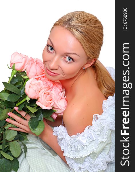 Portrait of the beautiful woman with a bouquet of roses of gently pink color, isolated on a white background, please see other photos of this series. Portrait of the beautiful woman with a bouquet of roses of gently pink color, isolated on a white background, please see other photos of this series