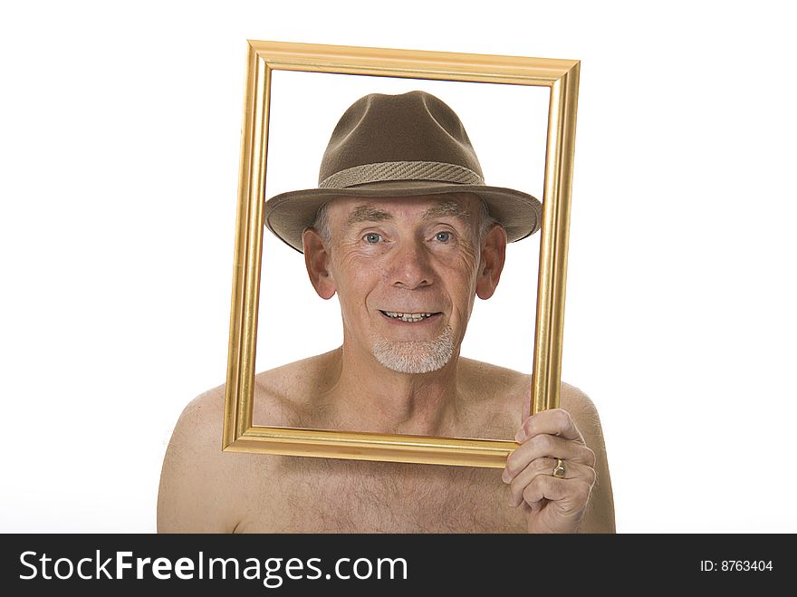 Unclothed senior man laughing through picture frame. Unclothed senior man laughing through picture frame