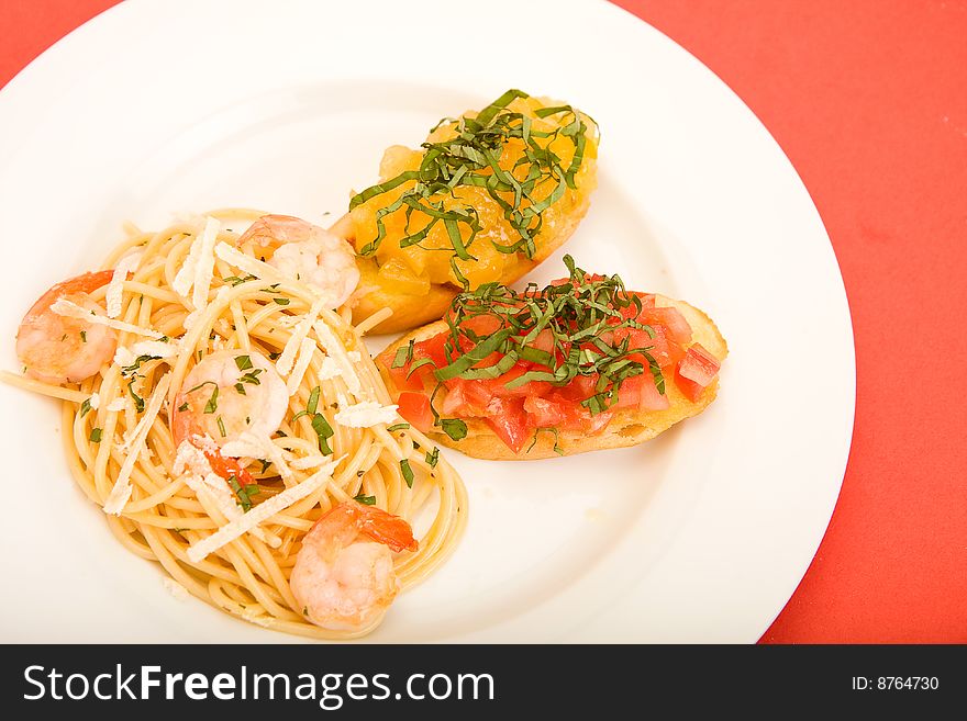 Shrimp pasta with garlic herb butter sauce and tomato and basil bruchetta. Shrimp pasta with garlic herb butter sauce and tomato and basil bruchetta