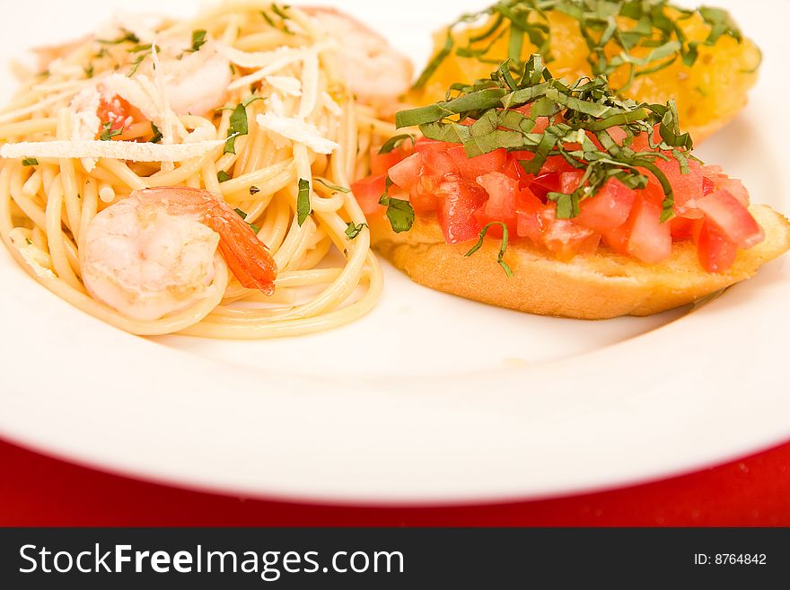 Shrimp pasta with garlic herb butter sauce and tomato and basil bruchetta. Shrimp pasta with garlic herb butter sauce and tomato and basil bruchetta