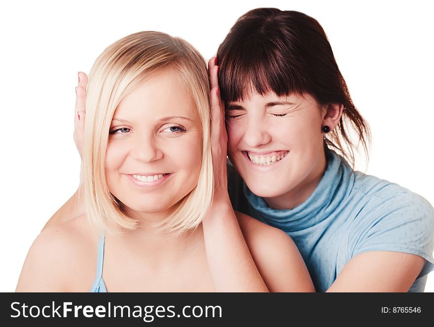 Two young smiling girls on white background. Two young smiling girls on white background