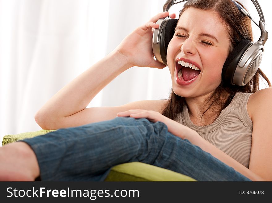 Young teenage girl listening to music. Young teenage girl listening to music