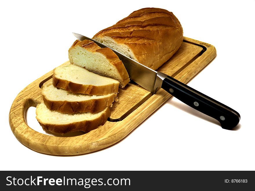 Long loaf sliced by kitchen-knife