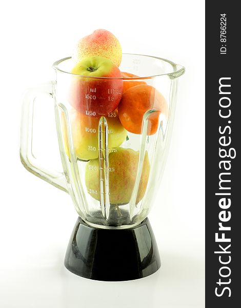 Fruits in mixer, apple, peach, mandarin