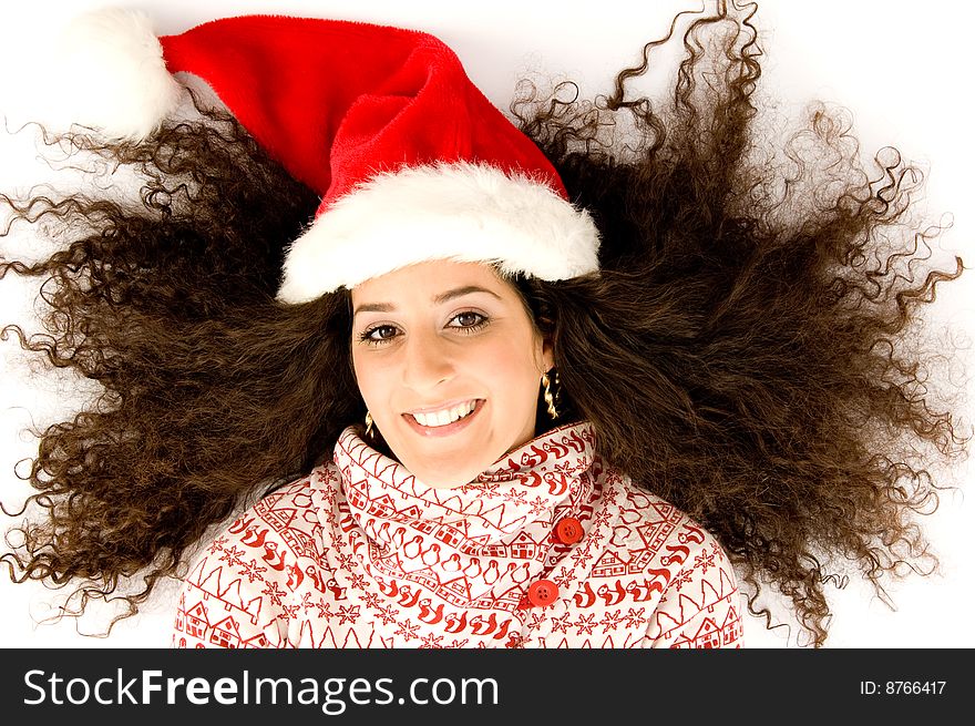 Hispanic female with christmas hat and lying with open hairs against white background