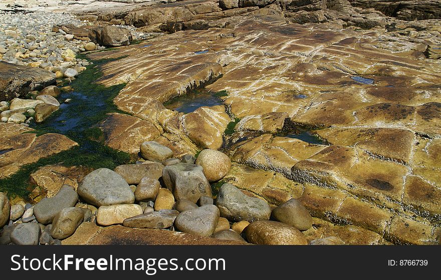Granite ledges, exposed at low tide,  Seawall Mount Desert Island, Acadia National park, Maine, New England