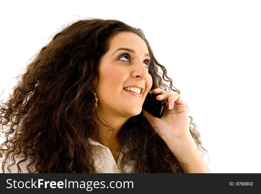 Latin american woman talking on phone on an isolated background