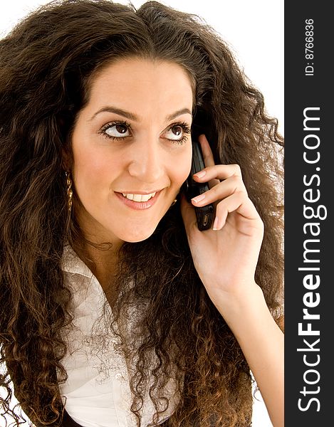 Beautiful woman busy with phone call on an isolated white background