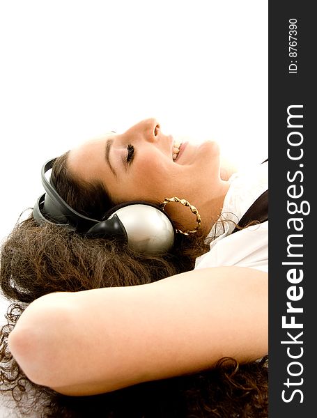 Pretty woman wearing headphones with white background