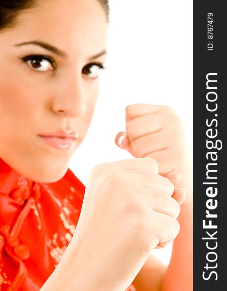 Beautiful woman ready to box against white background