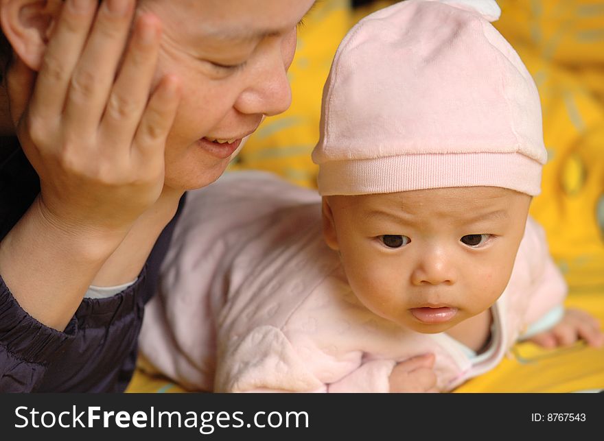 It is a cute chinese baby and his mother. he is 3 months. It is a cute chinese baby and his mother. he is 3 months.